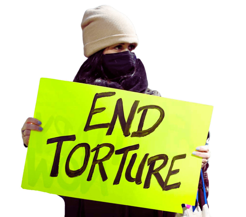 Protestor holding "End Torture" sign